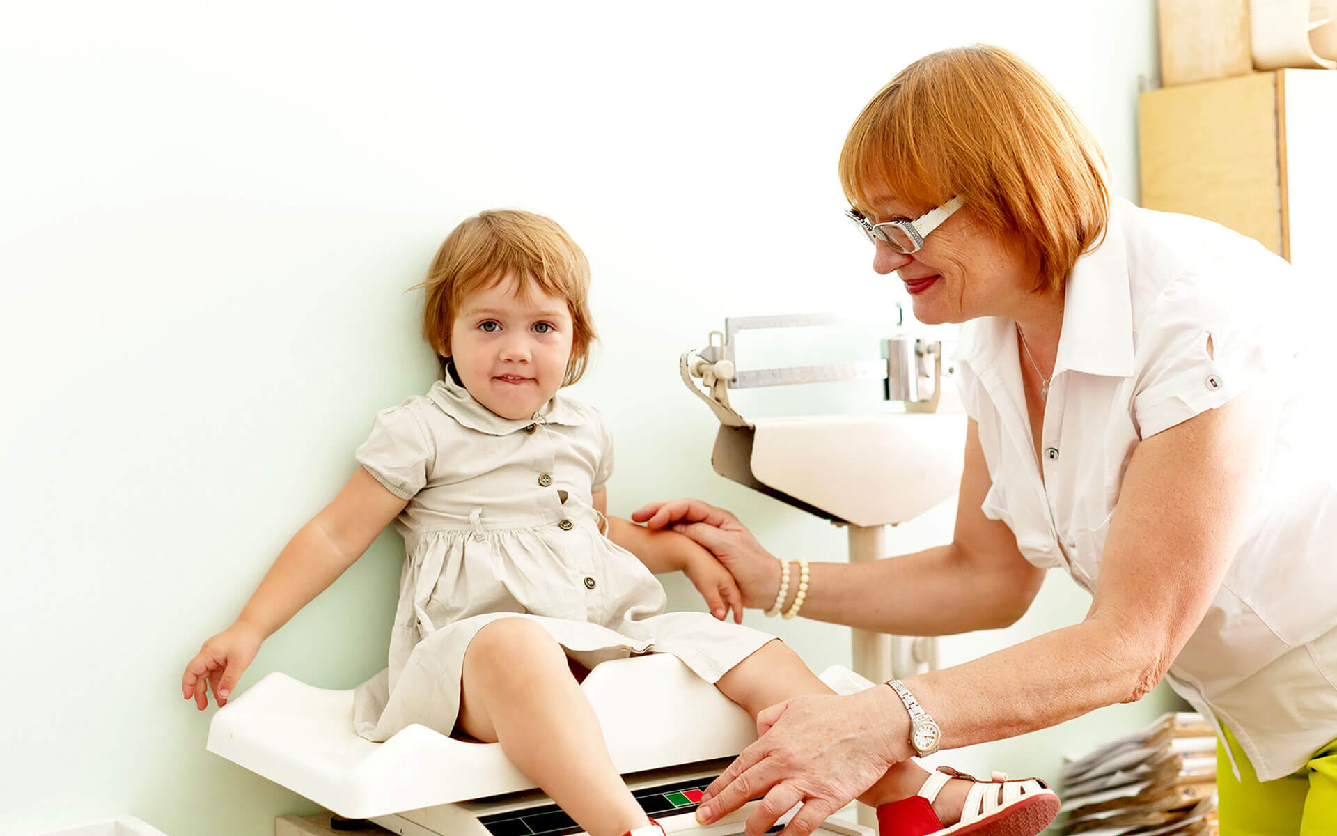 Pharmacist consulting with a customer in a pharmacy.